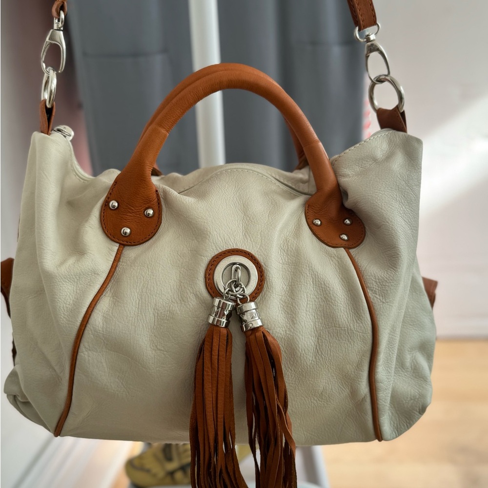 EUC Fellini buttery soft leather cream and tan hand/shoulder bag with tassels.